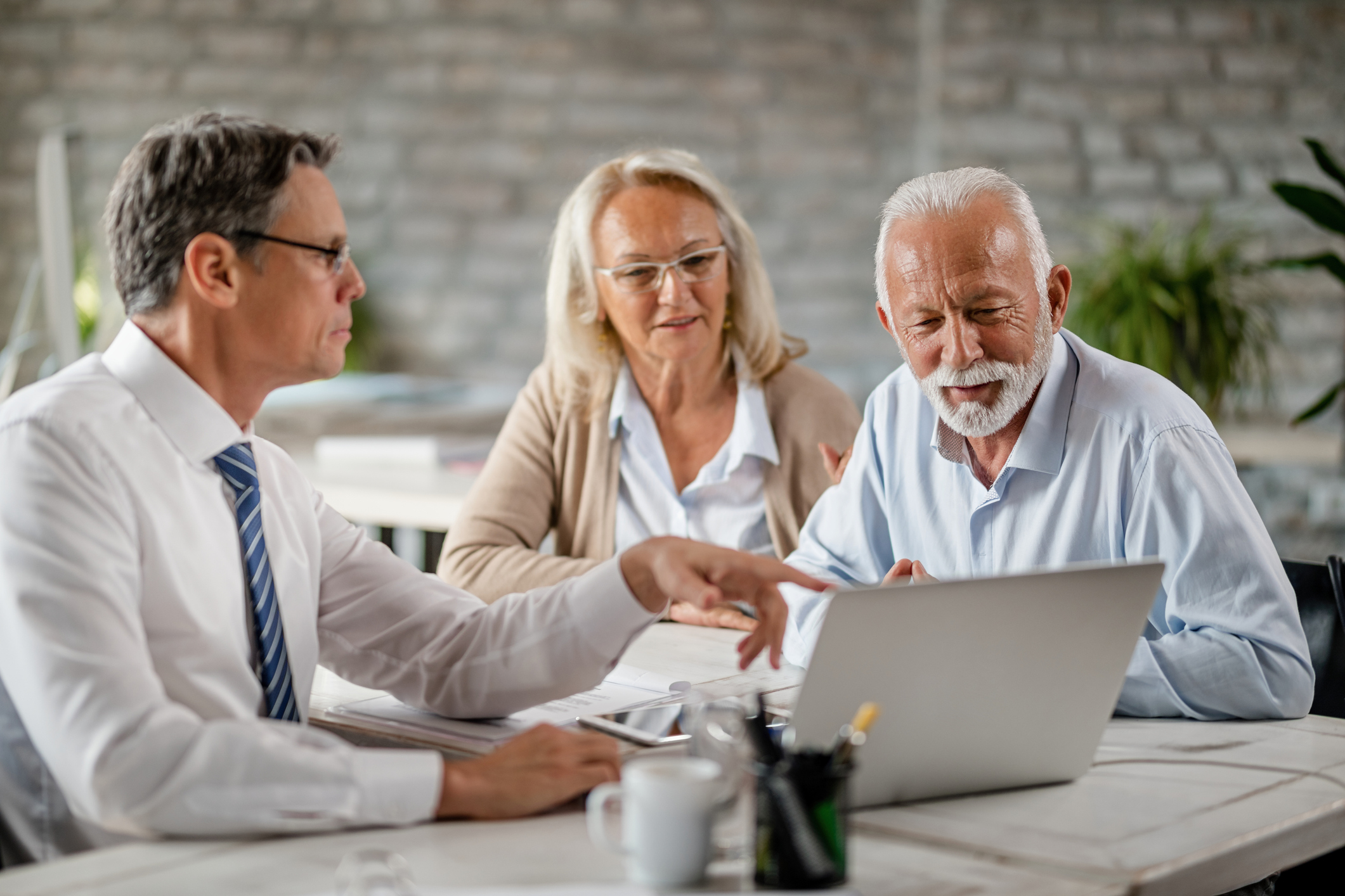 two people meeting with a laptop